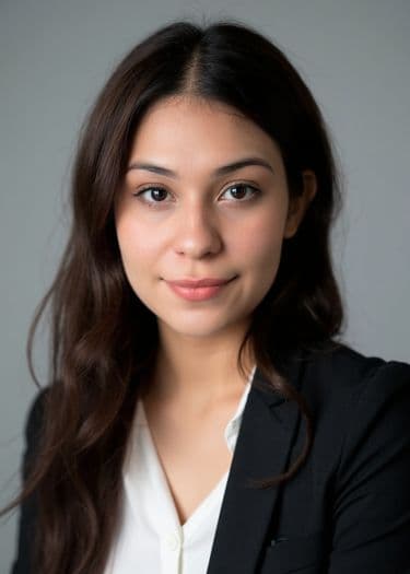 Professional headshot of a woman with straight dark hair, neutral expression, ERAS photo example